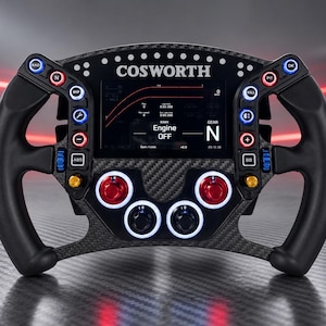 May include: A carbon fiber racing steering wheel featuring a central digital display with the text COSWORTH and Engine OFF. The wheel includes multiple illuminated buttons in red, blue, and white, along with rotary dials and ergonomic black grips.