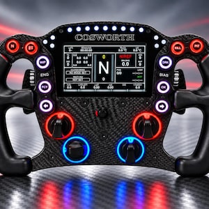 May include: A carbon fiber racing steering wheel featuring a central digital display with the text COSWORTH. The wheel includes numerous illuminated buttons in red, blue, and white, along with rotary dials and ergonomic black hand grips for control.