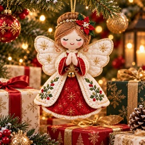 May include: A fabric angel ornament with brown yarn hair, a red and white quilted dress, and embroidered holly leaves. The angel has closed eyes, a small smile, and hands pressed together in prayer, featuring a gold bell at the waist and wings.