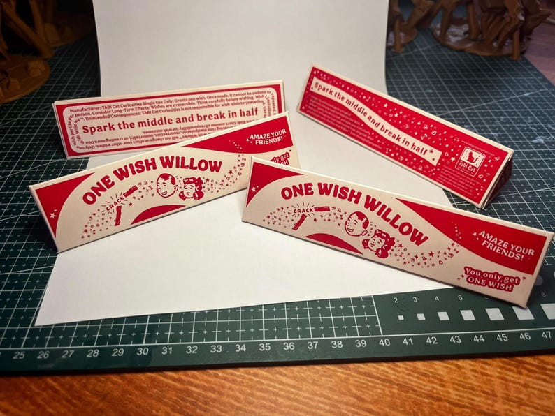 May include: Three rectangular red and white paper boxes labeled ONE WISH WILLOW. The packaging features illustrations of two faces, star motifs, and the text Spark the middle and break in half, Amaze your friends, and You only get ONE WISH.