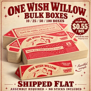 May include: A stack of flat, rectangular cardboard packaging for One Wish Willow, printed in red and cream. The boxes feature illustrations of two faces, the text 'Spark the middle and break in half', and 'You only get ONE WISH'.