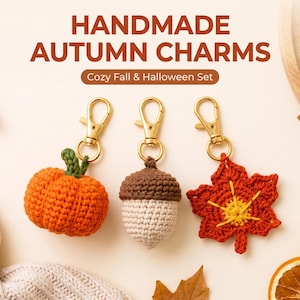 May include: Three handmade crochet charms featuring a pumpkin, an acorn, and a maple leaf, each attached to a gold-tone lobster clasp. The text HANDMADE AUTUMN CHARMS and Cozy Fall & Halloween Set is displayed above the items in brown lettering.