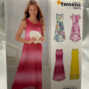 May include: New Look sewing pattern 6297 for tween sizes 8-16, featuring a sleeveless dress with a high-low hemline. The envelope displays a model in a pink ombre dress and illustrations of four dress variations in floral, camouflage, solid pink, and yellow.