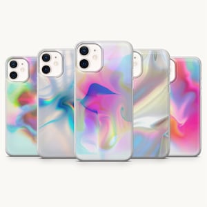 May include: Five smartphone cases arranged in a row, each featuring a unique, abstract, fluid design with a holographic, iridescent color palette. The cases display swirling patterns of pink, blue, purple, and white, with a clear, glossy finish.