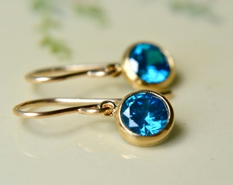 Tiny aqua cubic zirconia earrings with gold filled hooks, Petite blue synthetic gemstone jewellery