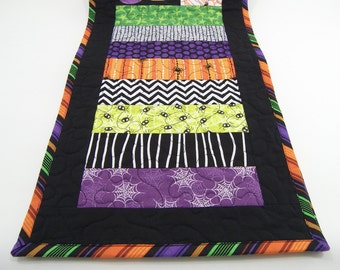 Halloween Table Runner, Quilted Table Topper with Spiders in Black, White, Orange, Green and Purple