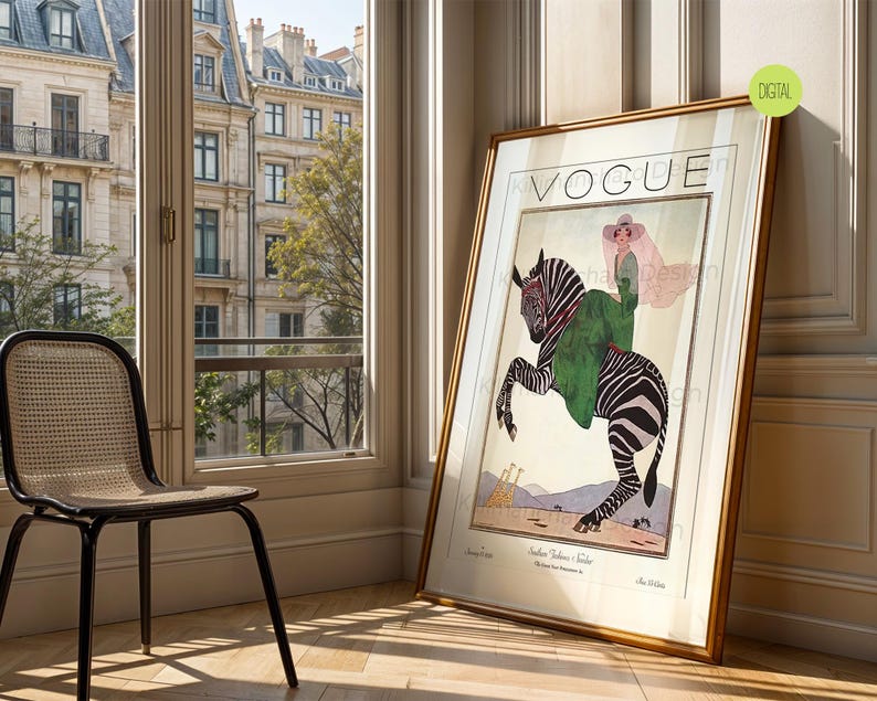 May include: A framed vintage Vogue magazine cover print featuring an illustration of a person in a green coat and wide-brimmed hat riding a zebra. The artwork includes the text VOGUE at the top and smaller text at the bottom, set against a light background.