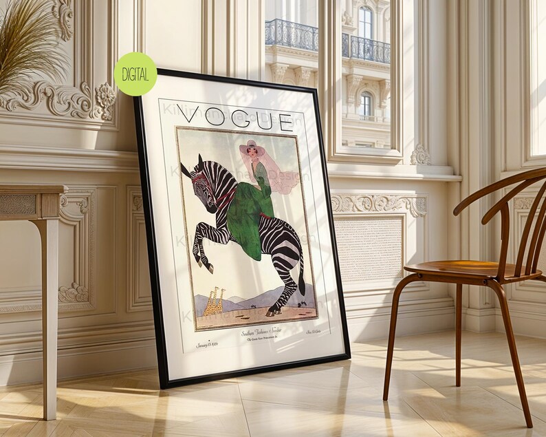 May include: A framed wall art print featuring a vintage Vogue magazine cover illustration. The artwork depicts a person in a green dress and wide-brimmed hat riding a zebra, with two giraffes in the background. The text VOGUE is printed at the top.