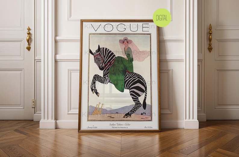 May include: A framed vintage Vogue magazine cover print featuring an illustration of a person in a green dress and wide-brimmed hat riding a zebra. The background shows a desert landscape with two giraffes. The text reads Vogue and January 15 1920.