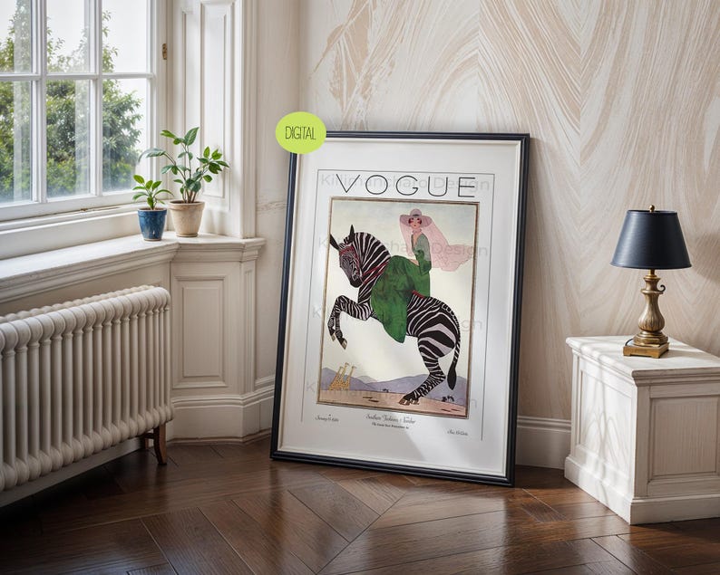 May include: A framed wall art print featuring a vintage Vogue magazine cover illustration. The artwork depicts a person in a green coat and wide-brimmed hat riding a zebra. The background shows a desert landscape with small giraffes in the distance.