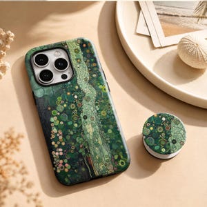 May include: A smartphone case and a matching circular phone grip featuring an abstract pattern of green, black, and gold circular motifs. The design includes a textured, moss-like vertical band surrounded by dark forest green and olive tones.