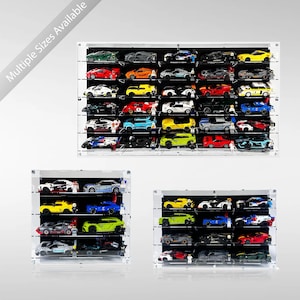 May include: Three clear acrylic wall-mounted display cases with black backings, each featuring multiple horizontal shelves filled with various colorful toy race cars and small figurines. The text Multiple Sizes Available is visible.