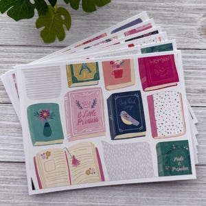 May include: A stack of cards featuring illustrations of book covers with titles like "A Little Princess", "The Bird Song", and "Pride & Prejudice".