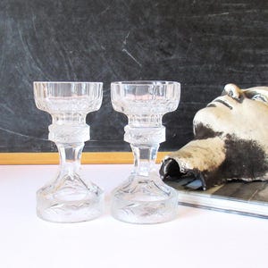 A set of vintage crystal glass candlestick holders, elegant table decor