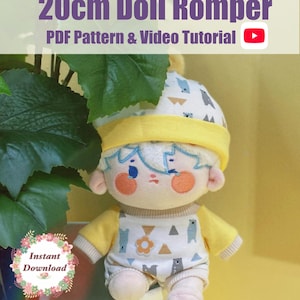 May include: A plush doll wearing a cream-colored romper and matching hat with a bear and mountain print, featuring yellow sleeves and trim. The text 20cm Doll Romper PDF Pattern & Video Tutorial and Instant Download are visible on the image.