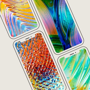 May include: A collection of five smartphones arranged in a diagonal pattern, each displaying a unique, vibrant, and abstract liquid-like wallpaper featuring swirling patterns of bright orange, blue, green, yellow, and pink colors.