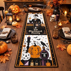 May include: A rectangular fabric table runner featuring a Halloween theme with a skeleton in a top hat, pumpkins, a crow, and potion bottles. The text reads The Blackwood Family, Potions, Curses, Herbology, Bat Wings, and Skeleton. The design uses orange, black, and white.