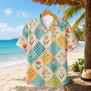 May include: A short-sleeved button-down shirt featuring a diamond-patterned patchwork design. The pattern alternates between light blue, yellow, and cream squares decorated with various floral illustrations, white polka dots, and blue gingham checks.