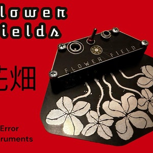 May include: Black and silver electronic music pedal with the text "FLOWER FIELD" and a design of stylized flowers. The text "flower fields" and "花畑" are also visible in the image.