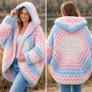 May include: A chunky crochet hooded cardigan featuring a soft gradient of pastel pink, white, and light blue yarn. The garment is constructed with a thick, textured stitch pattern, long sleeves, and an oversized hood, shown from front and back views.