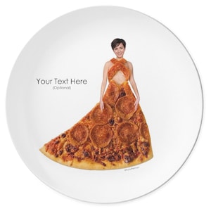May include: A round white plate featuring a graphic of a person wearing a dress made from a large slice of pepperoni pizza. The text "Your Text Here (Optional)" is printed on the left side, and the name "RubyPerman" is at the bottom right.