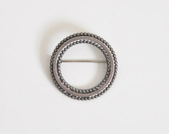 Vintage Come Full Circle brooch