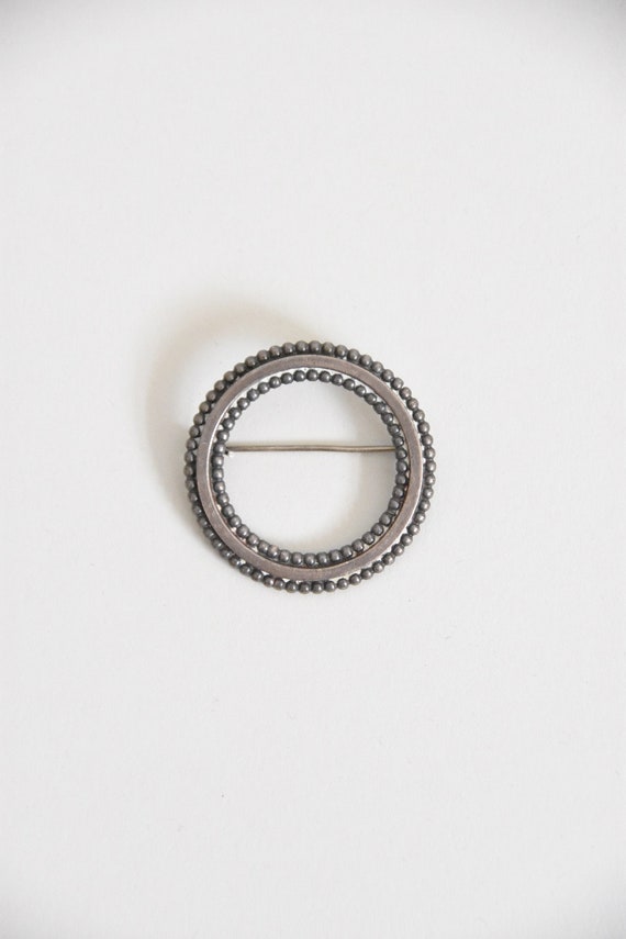 Vintage Come Full Circle brooch