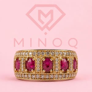 Bague en or jaune 14 carats, ornée d'un rubis rouge naturel ovale de 3,00 carats et de diamants de laboratoire.