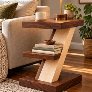 May include: A Z-shaped side table constructed from dark brown and light beige wood. The table features a flat top surface, a middle shelf, and a wide base. The design incorporates a diagonal support beam connecting the three horizontal levels.
