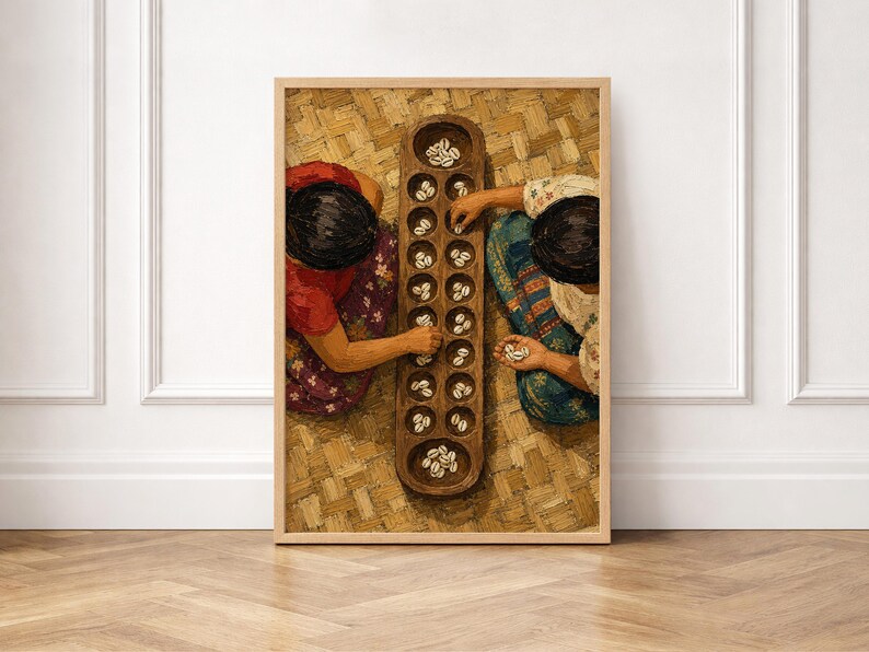 May include: A framed wall art print depicting two individuals playing a traditional board game with cowrie shells on a wooden board with multiple circular pits. The scene is set on a woven mat, showcasing vibrant clothing patterns and textures.