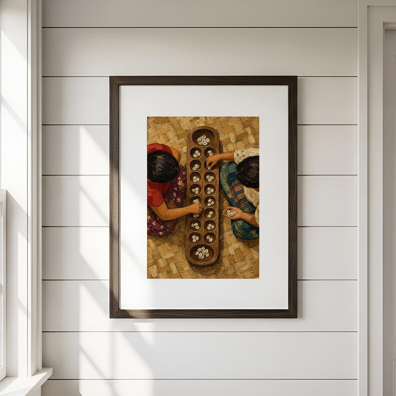May include: A framed wall art print depicting two individuals playing a traditional board game with a long wooden board containing multiple circular indentations filled with small white cowrie shells, set against a textured woven background.