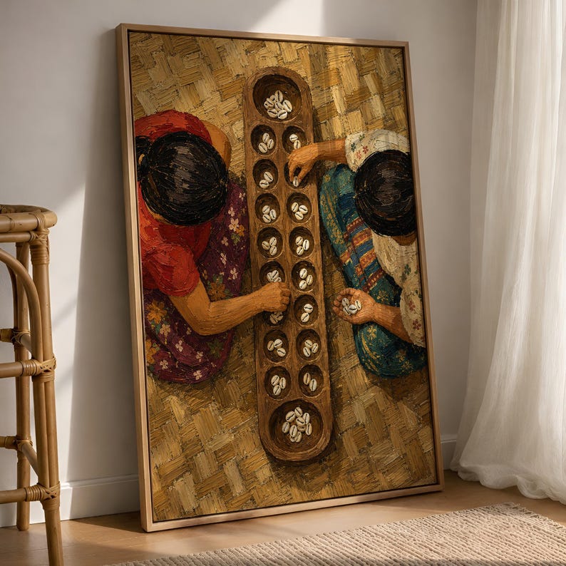 May include: A framed oil painting depicting two individuals from a top-down perspective playing a traditional board game with small white shells. The players are wearing colorful patterned clothing and are seated on a woven mat surface.