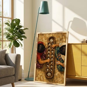May include: A rectangular framed wall art piece featuring a top-down view of two individuals playing a traditional wooden mancala board game with small white shells on a woven mat surface, displayed in a light-colored wooden frame.