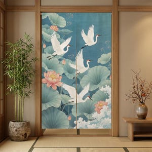 May include: A rectangular fabric door curtain featuring a printed design of white cranes with red crowns flying over large light green lotus leaves, pink lotus flowers, and stylized white water waves against a muted blue background.