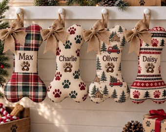 May include: Four bone-shaped Christmas stockings hanging in a row, each featuring a burlap bow at the top. The stockings are personalized with the names Max, Charlie, Oliver, and Daisy, and decorated with paw prints, plaid patterns, and winter scenes.