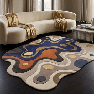 May include: An irregularly shaped area rug featuring a fluid, abstract pattern of layered, wavy bands in shades of deep blue, burnt orange, charcoal gray, beige, and mustard yellow, accented with scattered circular motifs throughout the design.