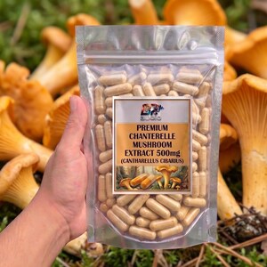 May include: A clear plastic resealable pouch filled with beige capsules. The label reads Premium Chanterelle Mushroom Extract 500mg (Cantharellus Cibarius) with an illustration of mushrooms. The pouch contains many small, cylindrical, light-colored capsules.