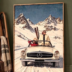 May include: A framed wall art print depicting a vintage white Mercedes-Benz convertible driving through a snowy mountain landscape. Two individuals are inside the vehicle, one wearing a white fur coat and the other a red jacket, with skis visible.