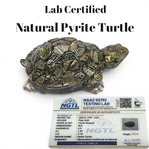 May include: A carved natural pyrite turtle with a metallic gold and dark grey finish, accompanied by a white Naaz Gems Testing Lab certificate of authenticity. The text on the certificate includes Lab Certified, Natural Pyrite Turtle, and report details.