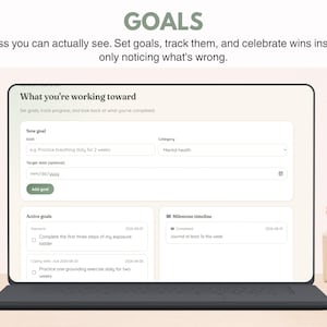 May include: A digital interface displayed on a laptop screen titled GOALS, featuring a section labeled What you're working toward. The screen includes input fields for a new goal, category, and target date, alongside sections for active goals and a milestone timeline.