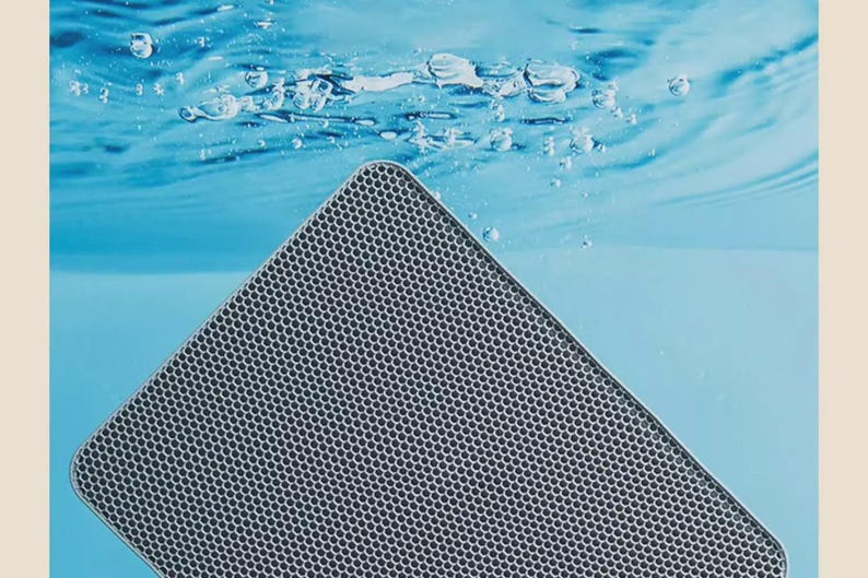 Extra Large Waterproof Cat Litter Mat with double-layer honeycomb design that traps litter, cat sand, and debris from paws. Non-slip backing keeps the mat secure while protecting hardwood, tile, and laminate floors. Made from durable, washable EVA material that is soft on cat paws and easy to clean. Perfect litter box accessory for indoor cats, helping reduce litter tracking and keeping your home cleaner and more organized.