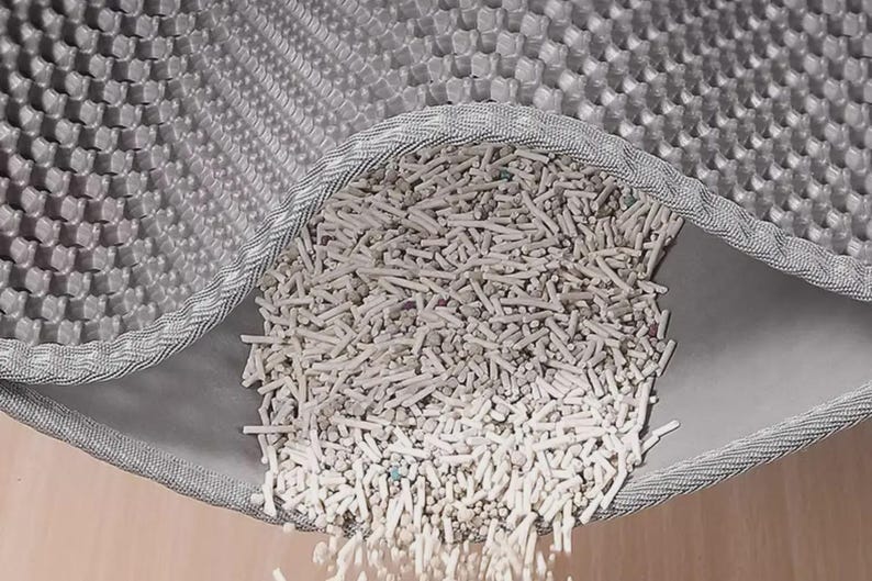 XL Cat Litter Catcher Mat designed for maximum litter control and floor protection. The honeycomb surface captures scattered litter and stores it between layers for quick disposal and reuse. Waterproof bottom layer prevents leaks and moisture damage, while the non-slip design ensures stability. Ideal for cat owners seeking a durable, washable, reusable litter trapping mat for single or multi-cat households.
