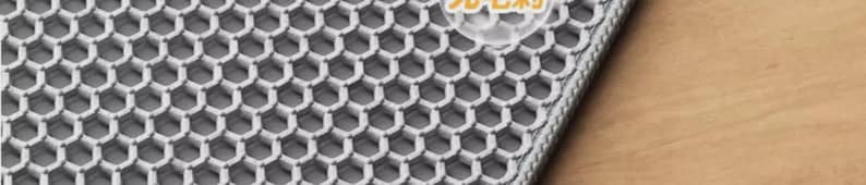 Large Honeycomb Cat Litter Mat made from durable EVA material with a waterproof bottom layer and non-slip backing. The double-layer design efficiently traps litter, cat sand, and debris while protecting floors from scratches and spills. Easy to empty, wash, and reuse. Perfect for cat owners looking for a practical litter box mat, cat accessory, and floor protection solution.