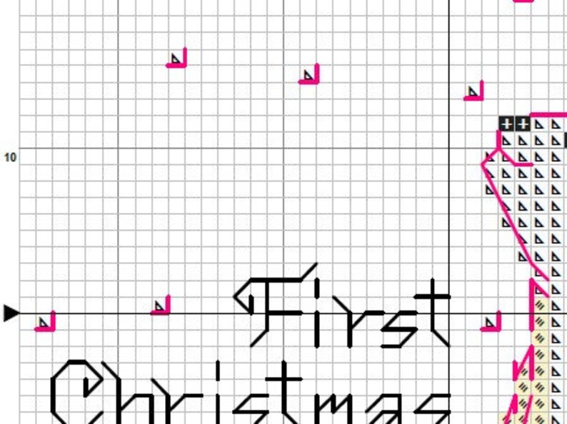May include: A cross-stitch pattern printed on a white grid background featuring the black text First Christmas. The design includes various symbols such as pink triangles and black plus signs arranged in a grid layout for embroidery guidance.