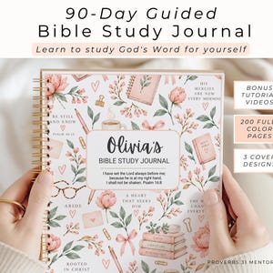 May include: A spiral-bound 90-Day Guided Bible Study Journal with a white cover featuring pink floral illustrations, hearts, and stationery items. The center label reads Olivia's Bible Study Journal with Psalm 16:8 text. Includes bonus tutorial videos.