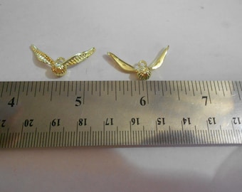 Amuleto o colgante - SNITTLE DORADA (oro)