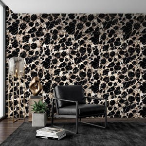 May include: A black and white marble patterned wallpaper featuring a high-contrast, fragmented stone texture. The design consists of irregular, jagged black shapes separated by thin, light-colored veins, creating a bold, repeating geometric pattern.
