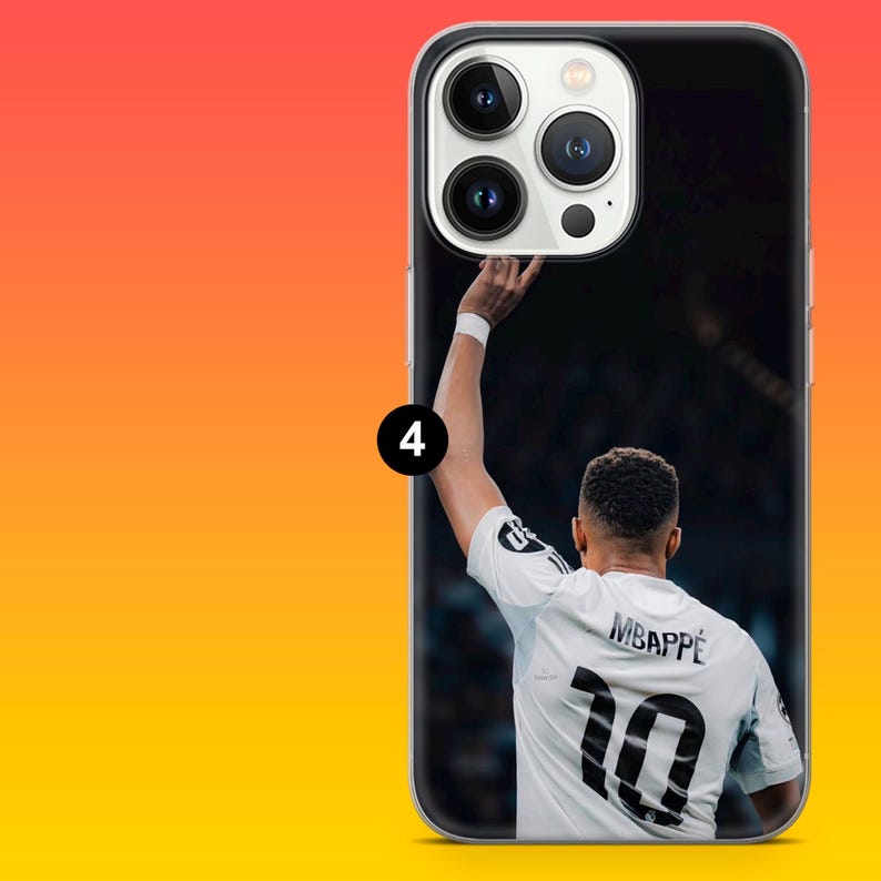 May include: A clear smartphone case featuring a printed image of a football player from behind, wearing a white jersey with the name MBAPP&Eacute; and the number 10 in black. The player has one arm raised, and the case includes a camera cutout section.