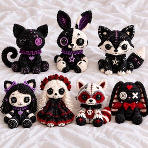 May include: A collection of seven handmade crochet plush toys featuring various creatures including a black cat, a split-colored rabbit, a fox, a doll with a skull face, a raccoon, and a rabbit with bat wings, all decorated with buttons and charms.