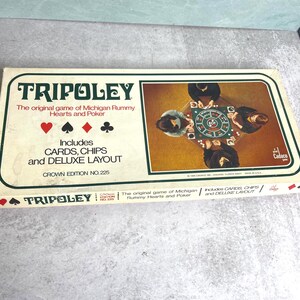 May include: A vintage Tripoley board game box. The box is white with green trim and features the game's name, suit symbols, and an image of people playing. The box includes cards, chips, and a deluxe layout.